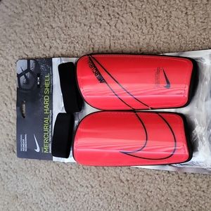 Nike Mercurial Hard Shell red shin guards. Adult unisex M. Like new. Blue sox YL